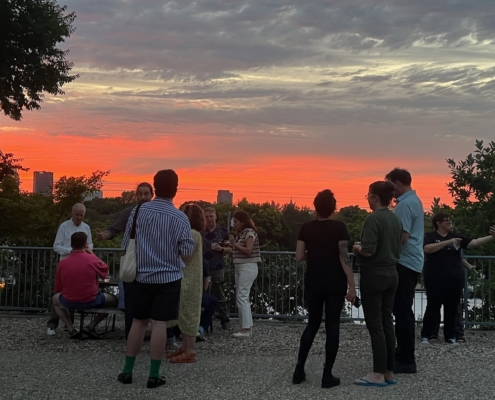 Gathering At Sunset Outside The Quonset Hut