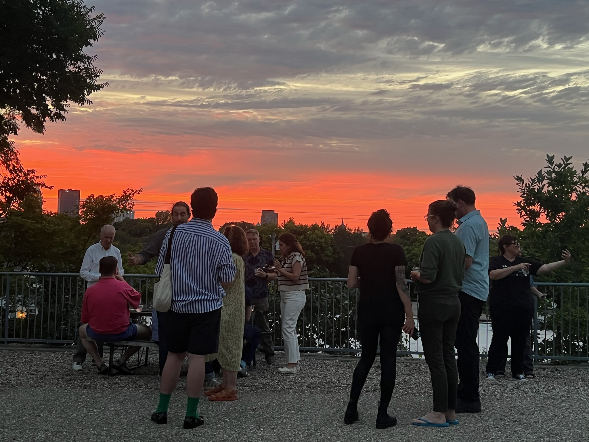 Gathering At Sunset Outside The Quonset Hut